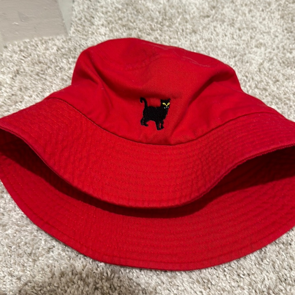Red SportsMan bucket hat with cat detail.